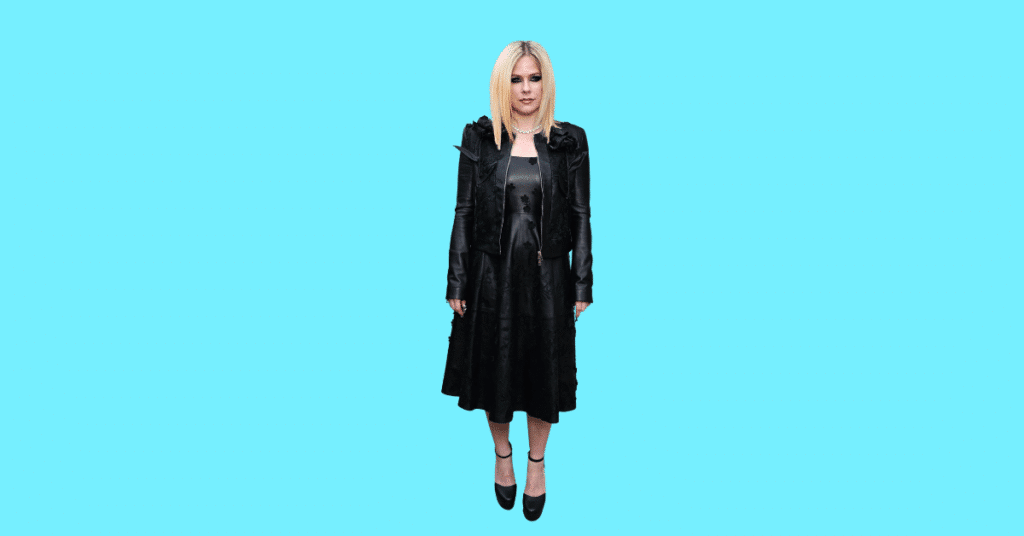 A full body picture of Avril Lavigne showing characteristics like height, age, and weight.
