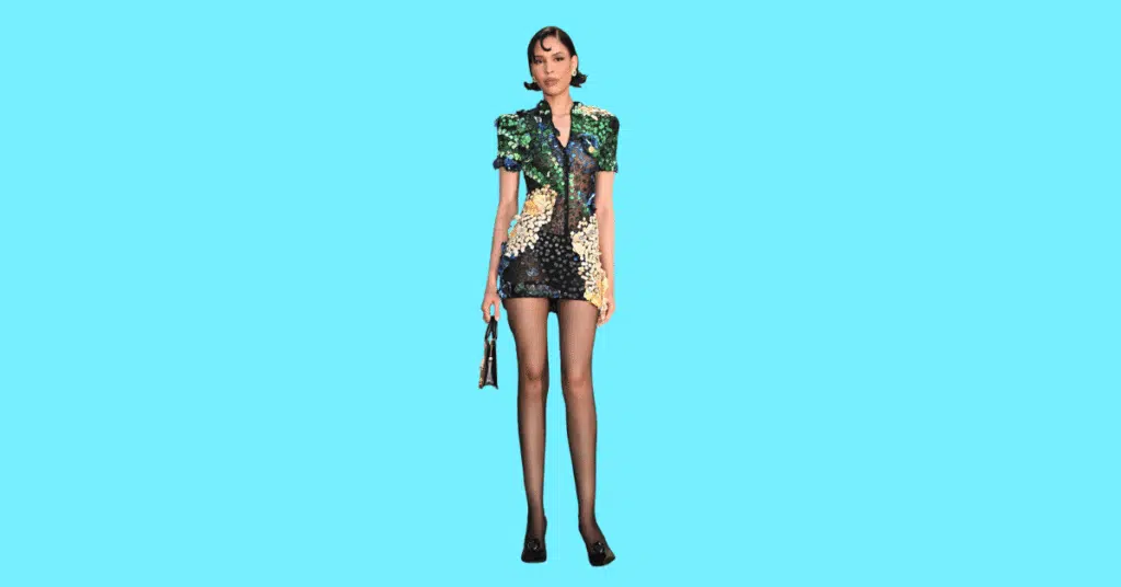 A full body picture of Bella Hadid showing characteristics like height, age, and weight.