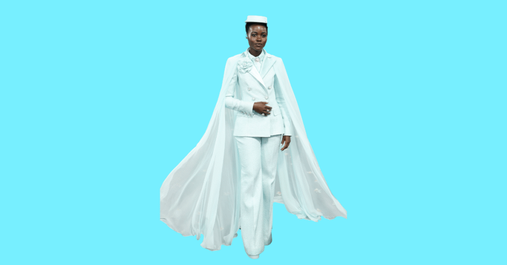 A full body picture of Lupita Nyong'o showing characteristics like height, age, and weight.